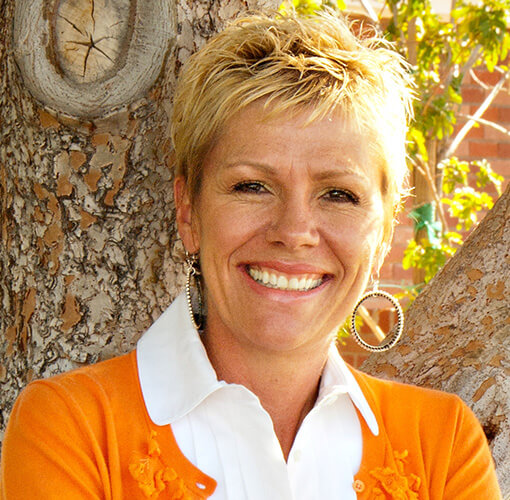 Judy Kay smiling outdoors
